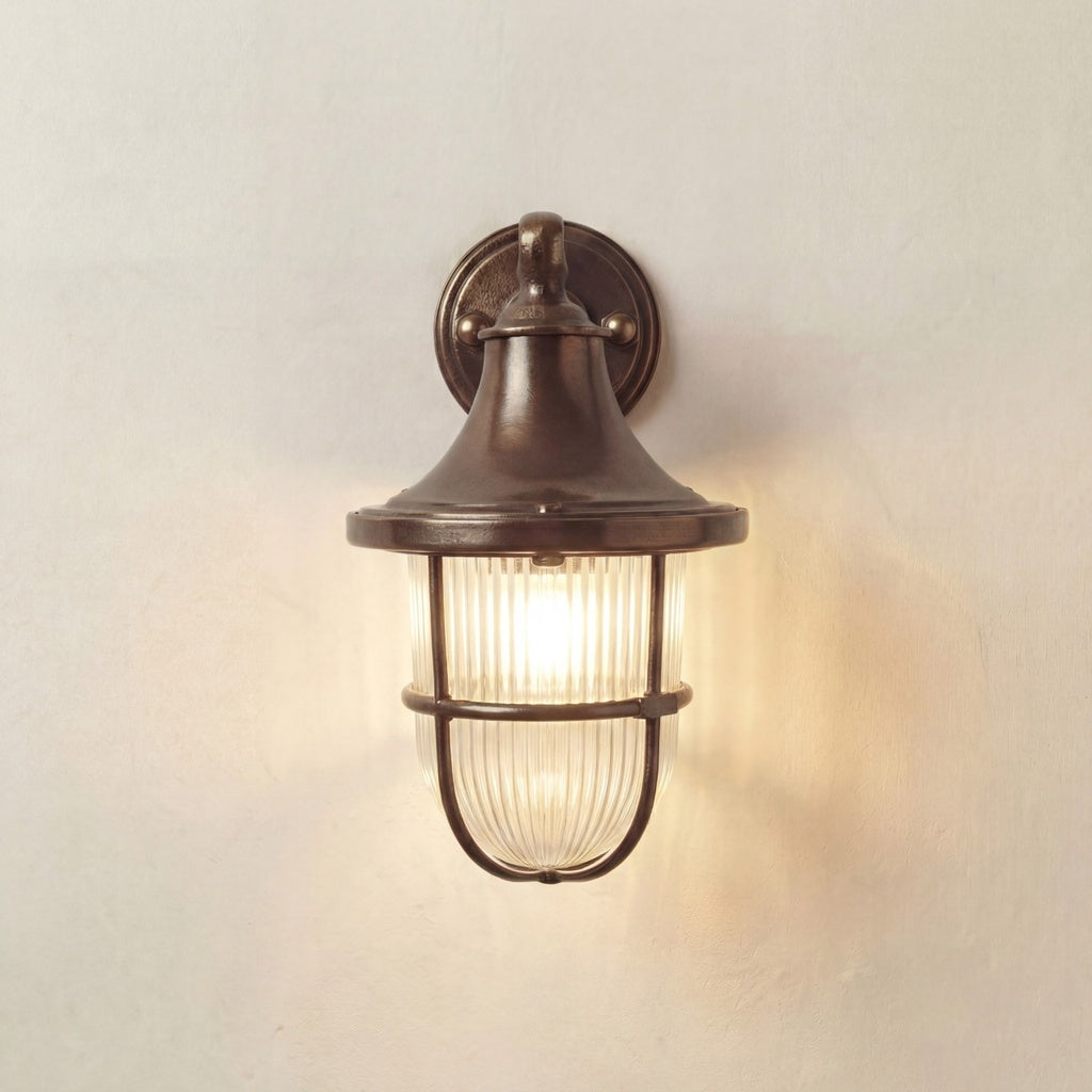 Vintage-style wall-mounted light fixture on a plain wall.