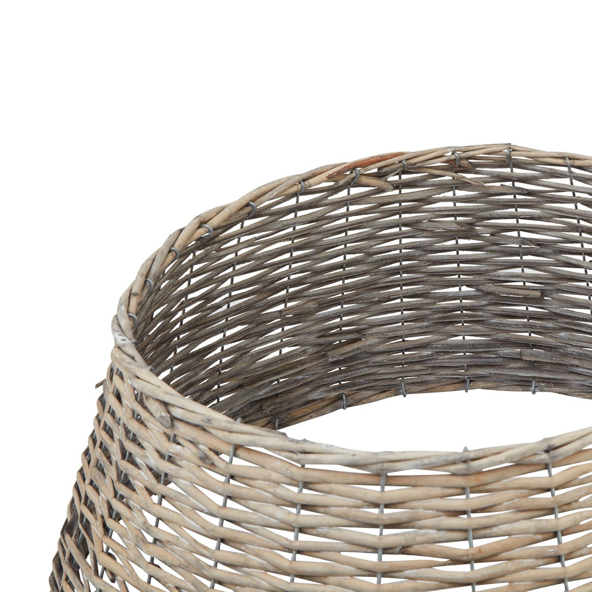 Close-up of the woven wicker weave and bound rim of the tree skirt