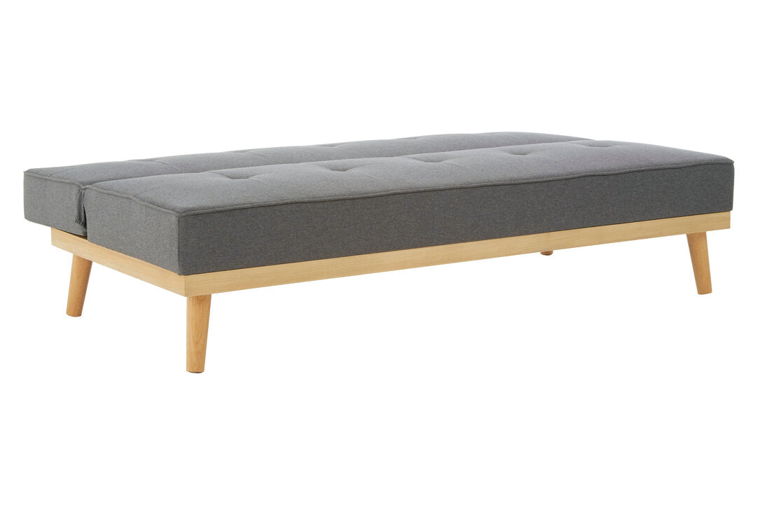 Gray upholstered flat sofa bed with wooden legs on a white background