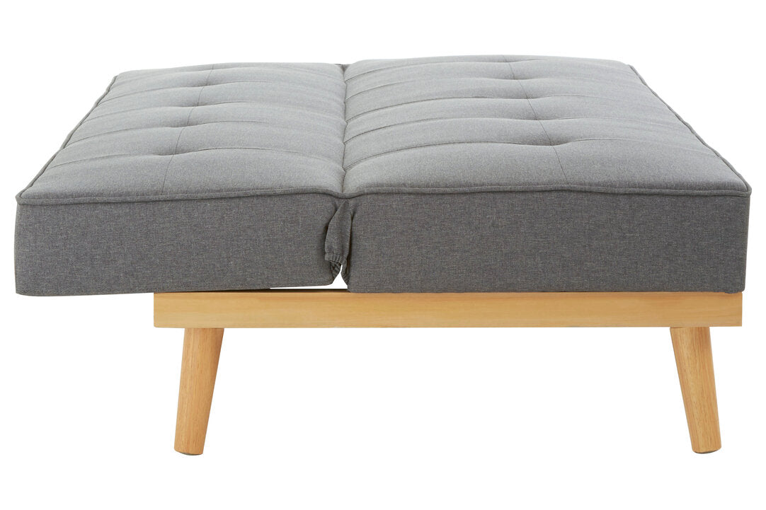 Gray upholstered bed with wooden legs on a white background
