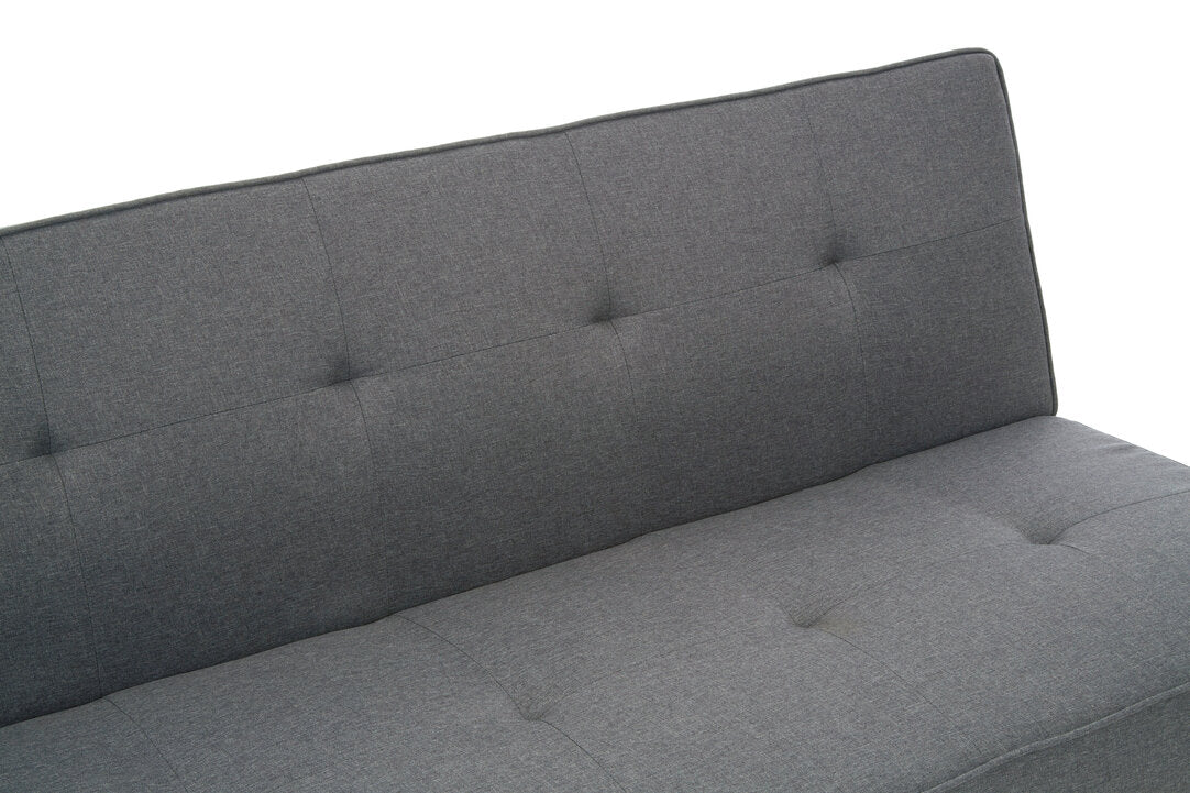 Gray upholstered headboard with tufted design on a white background