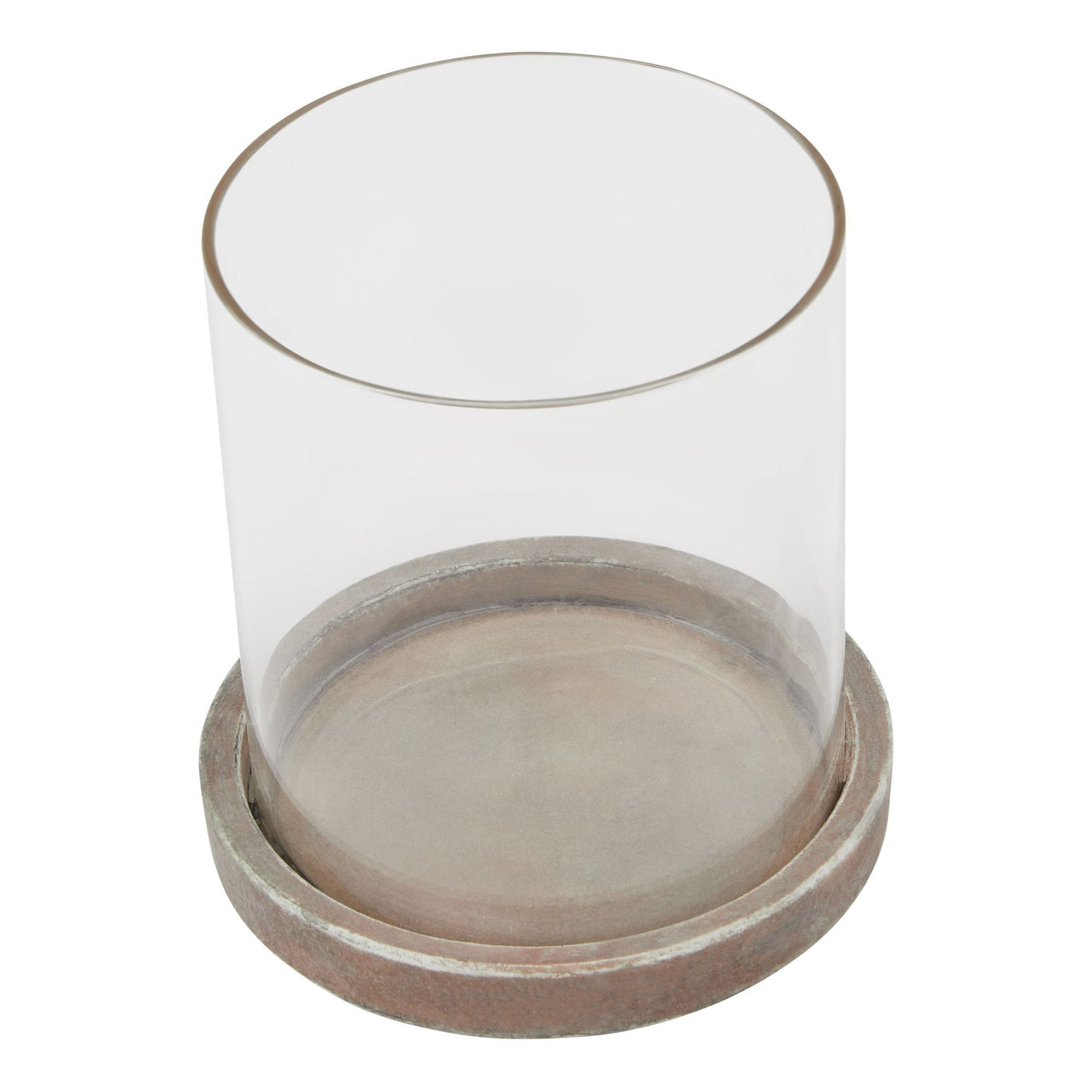 A glass hurricane lantern with a brown ceramic base