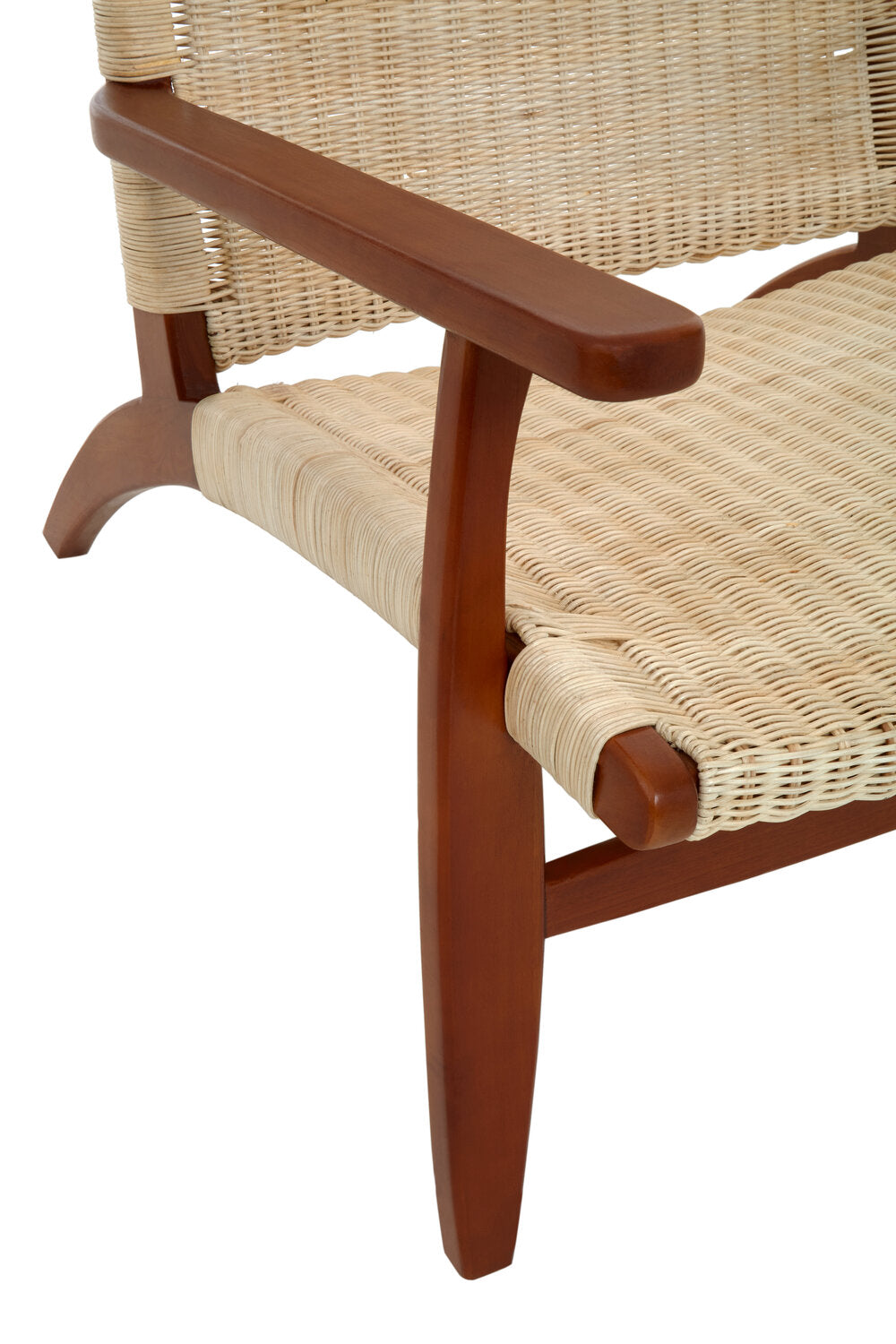 Close up of the side of a cream rattan armchair with wooden frame.