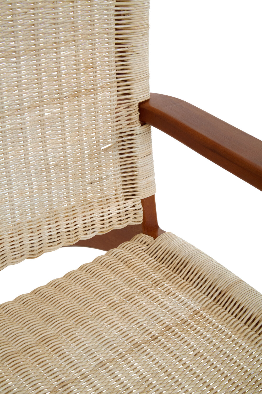 Close up of a cream rattan chair with mahogany frame.