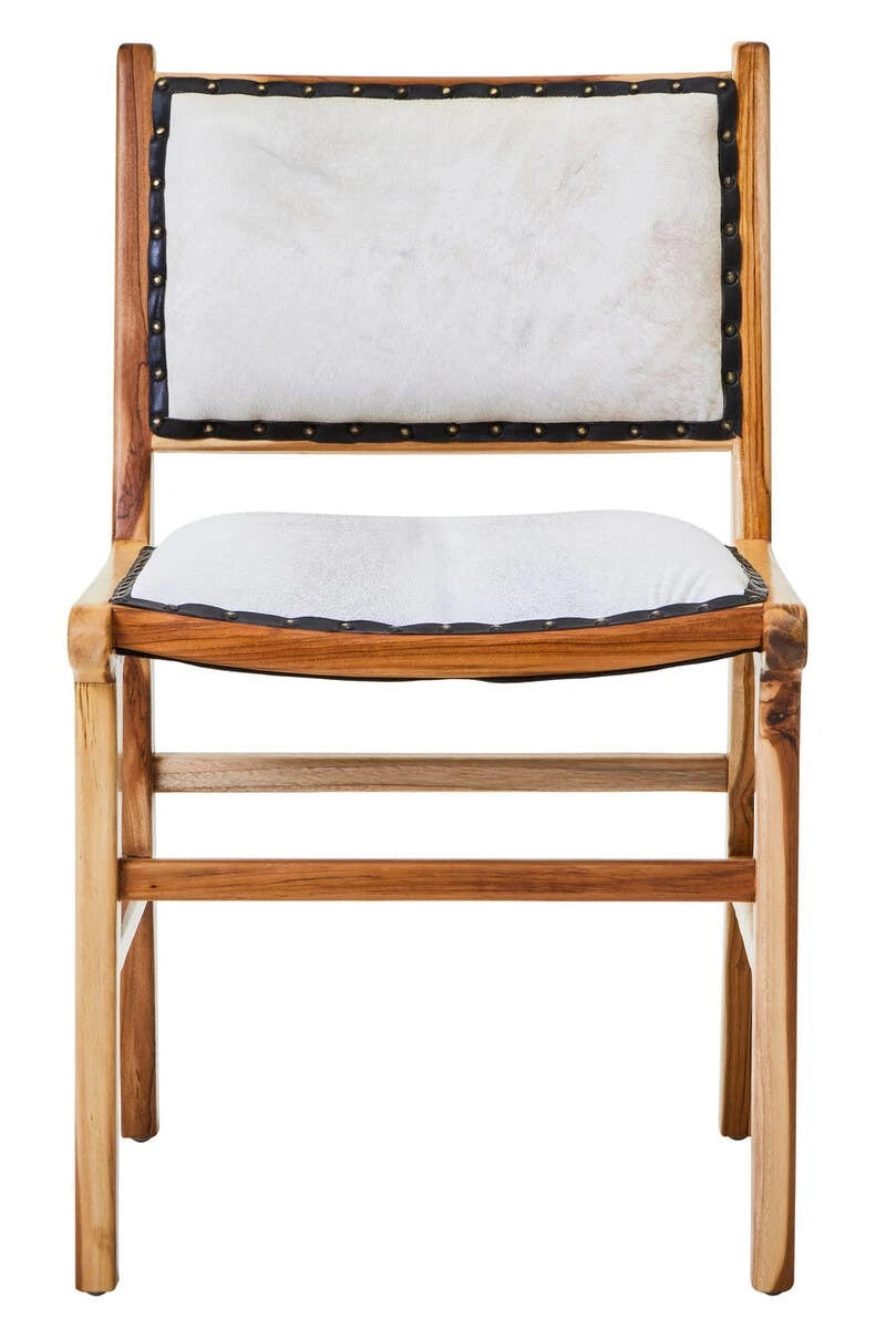 Front view of the Jakarta Cowhide and Teak Dining Chair, with cream cowhide edged in black leather and studs.