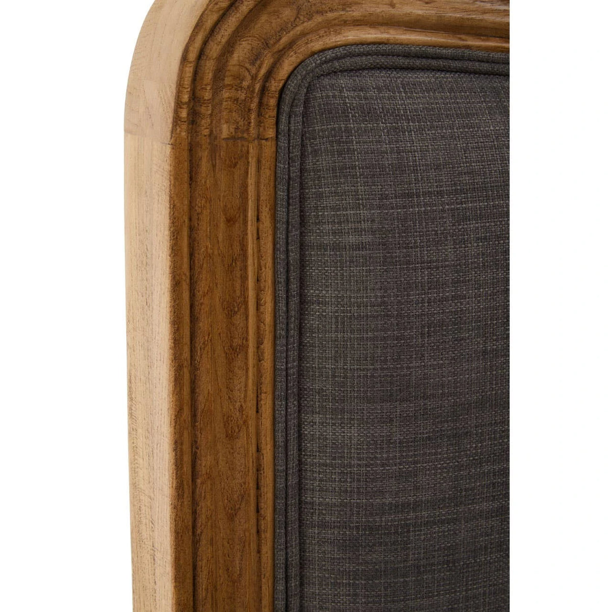 Close-up of the moulded oak frame edge against the grey linen-look upholstery on the Vienne bed.