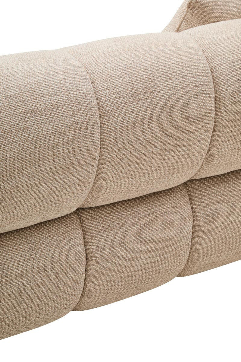 Close-up of a beige textured sofa with a white background