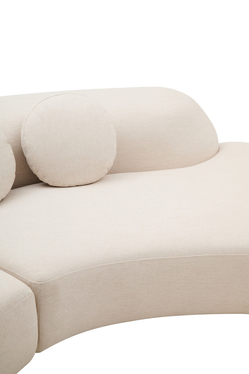 Cream linen curved sofa with round cushions on a white background