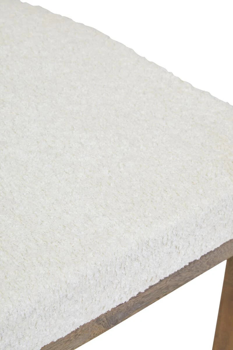 Close-up of the textured cream bouclé upholstery on the seat of the Hawthorn Grey Dining Chair.