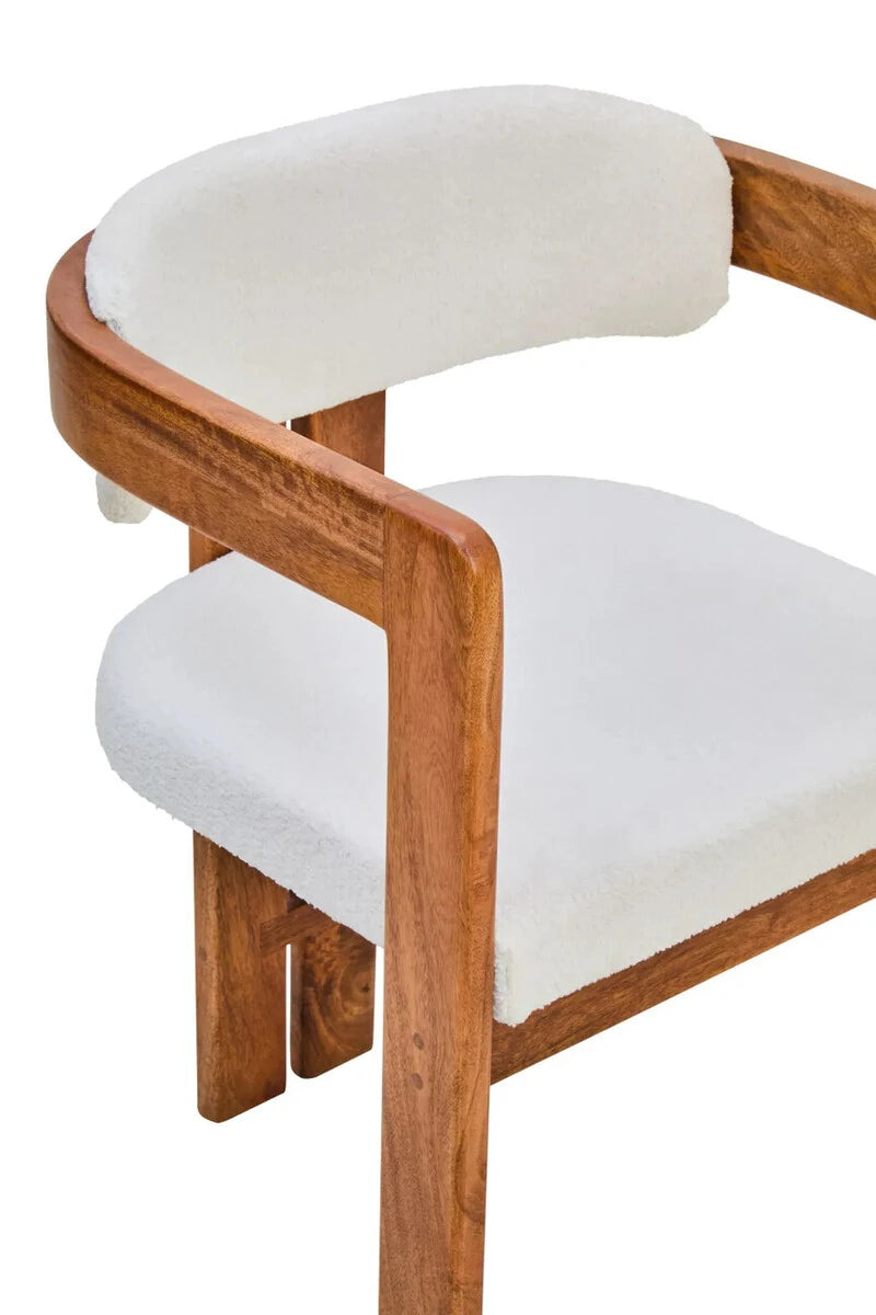 The Hawthorn Dining Chair from above, showing the curved bouclé backrest and deep cream bouclé seat.