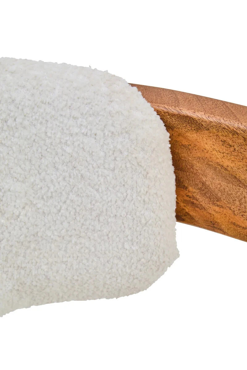 Close-up of the textured cream bouclé upholstery against the mango wood frame of the Hawthorn Dining Chair.
