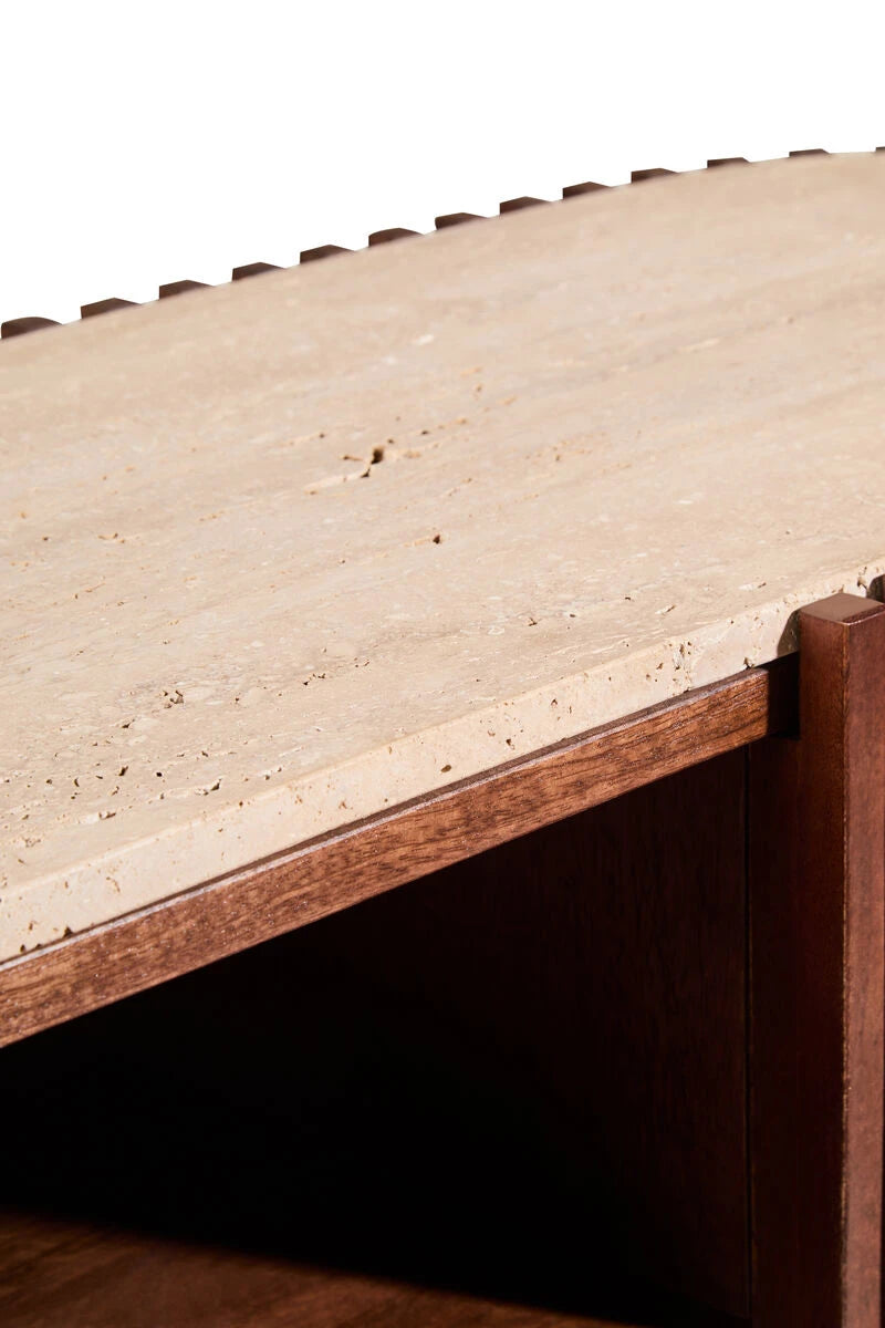 Close-up of the travertine top and shelf inside the Solmere media unit