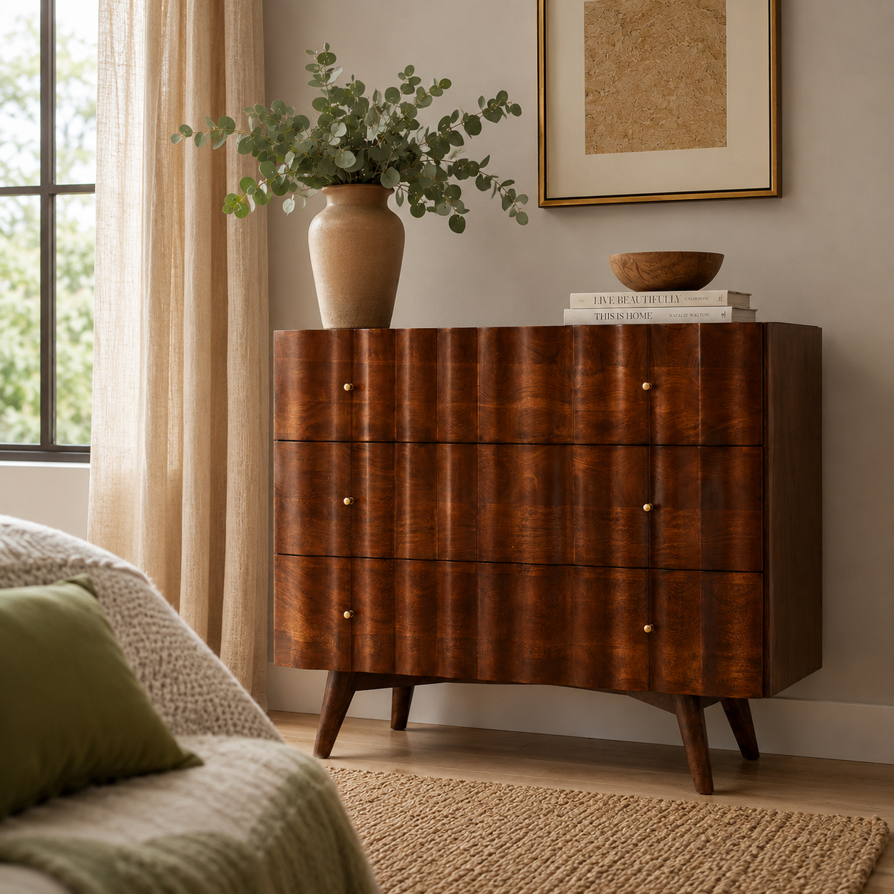 Wooden chest of drawers with decorative items in a bedroom setting