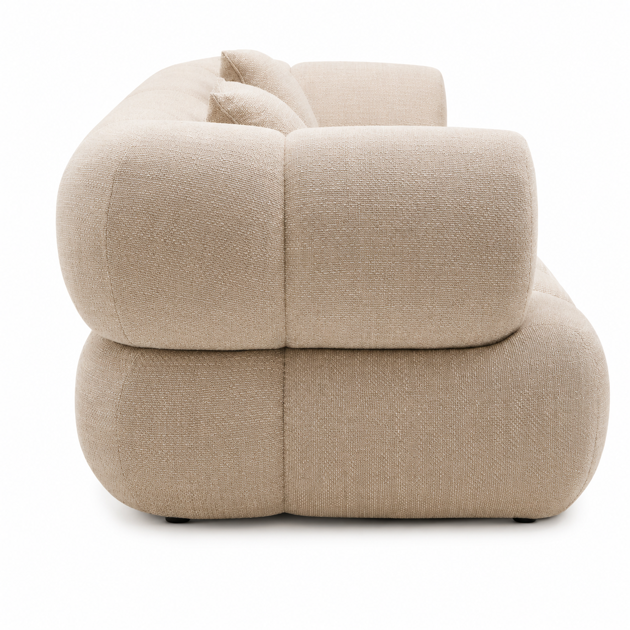 Side view of Orvella cream linen sofa on a white background
