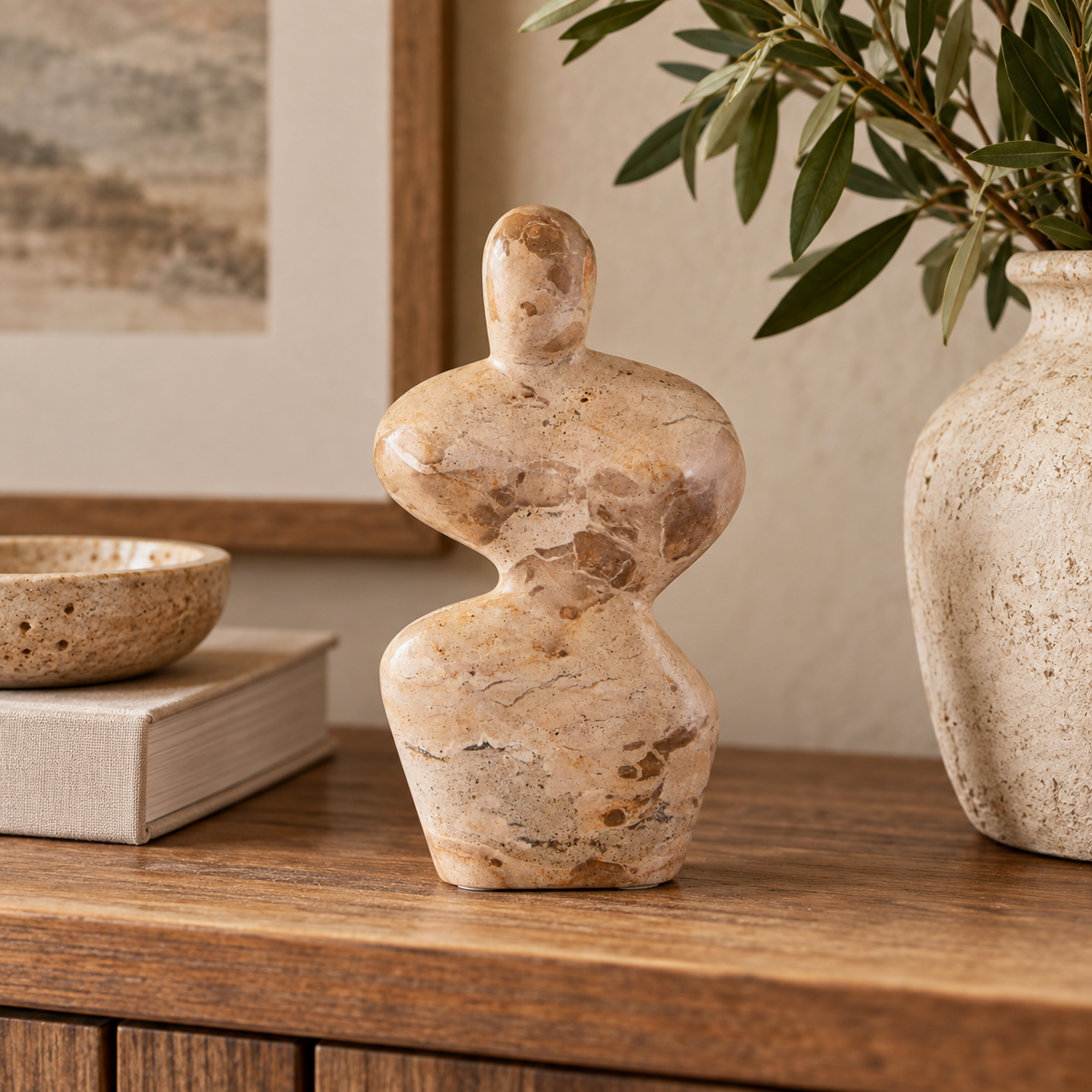 Ossa Chocolate Marble Curved Sculpture, a chocolate marble abstract sculpture with organic curves, displayed on a rustic wooden console table in a warm neutral interior.