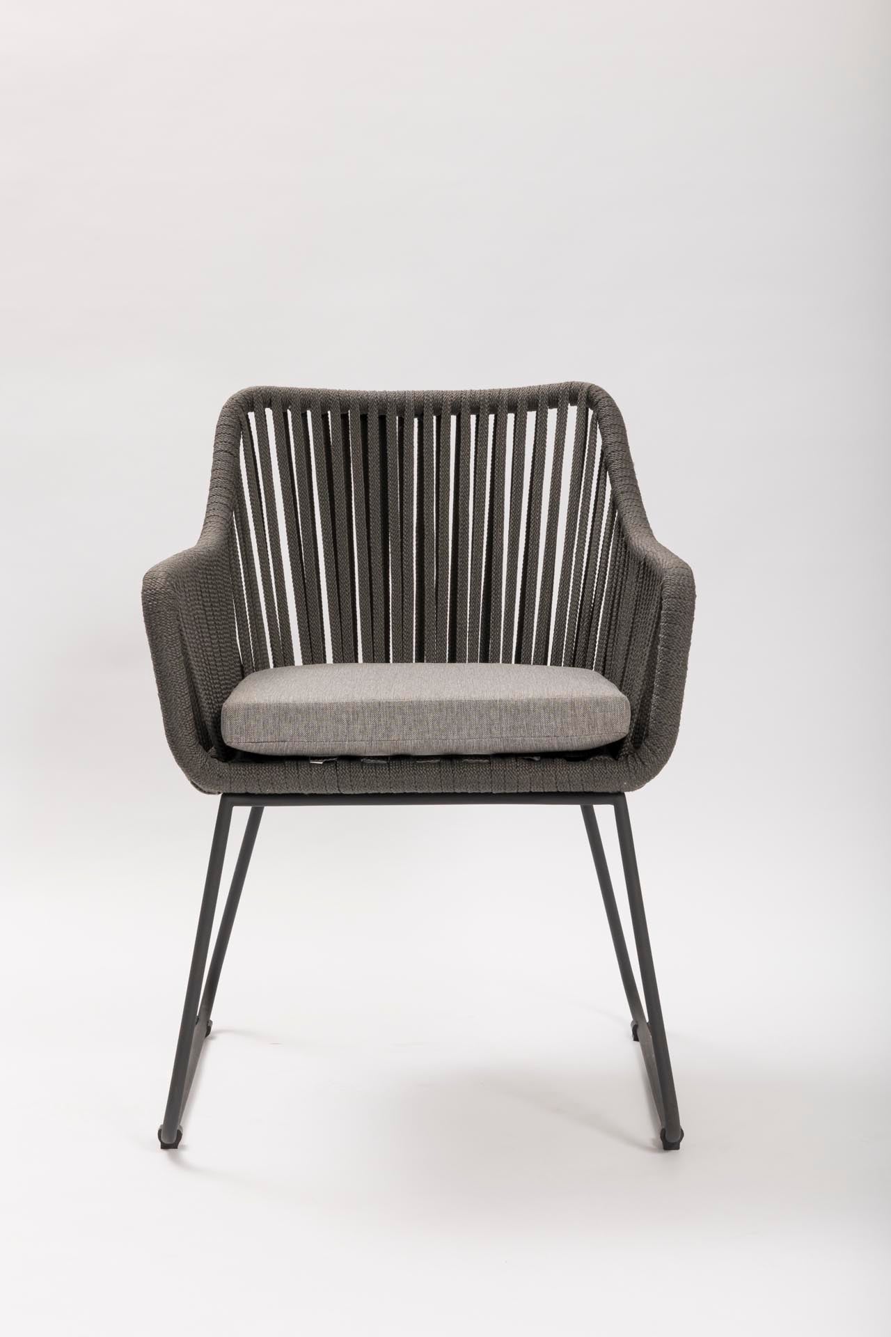 Gray outdoor armchair with a cushion on a white background