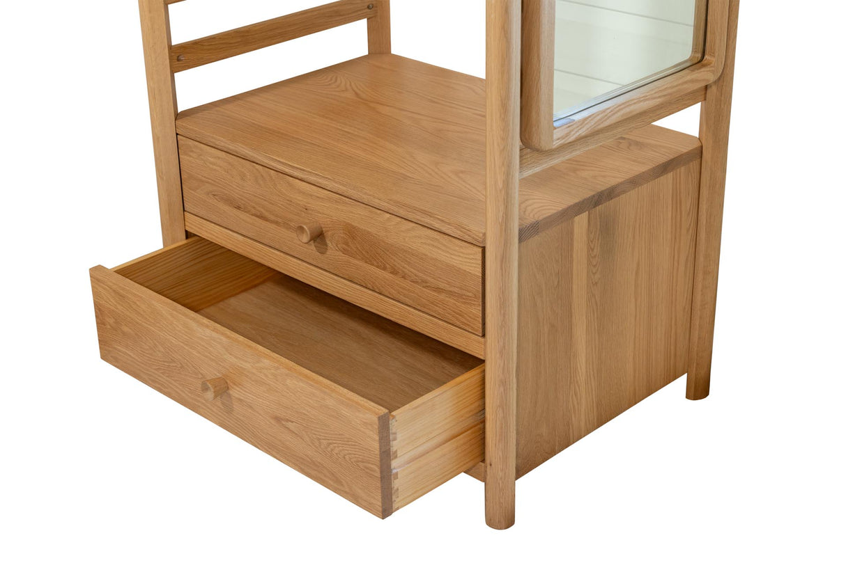 A light oak wood guest open wardrobe with a rectangular mirror on the upper right and an open drawer pulled out on the lower left, shown against a plain white background.