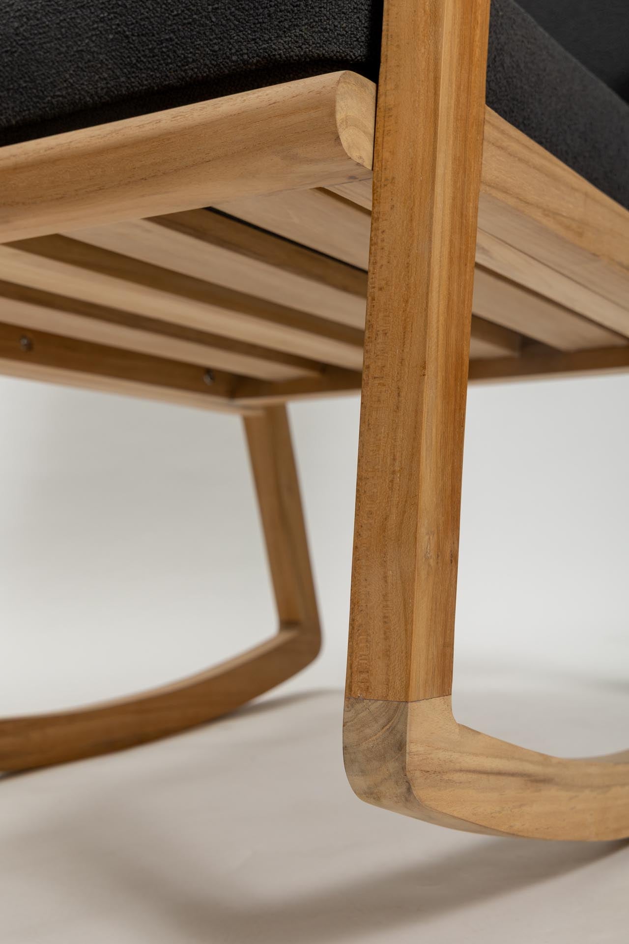 Close-up of a wooden chair with a blurred background