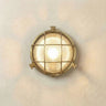 Grand cabin bulkhead outdoor wall light in raw brass on a neutral wall