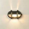 Wall-mounted light fixture with glass cover on a neutral background