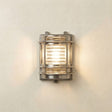 Wall-mounted outdoor light fixture on a neutral wall