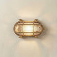 Horatio junior bulkhead outdoor wall light in raw brass on a neutral wall