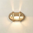 Gold wall light fixture on a white wall
