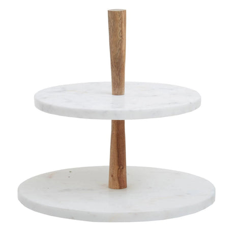 The Loxley Two Tier Cake Stand with two round white marble tiers on a tapered acacia wood post.