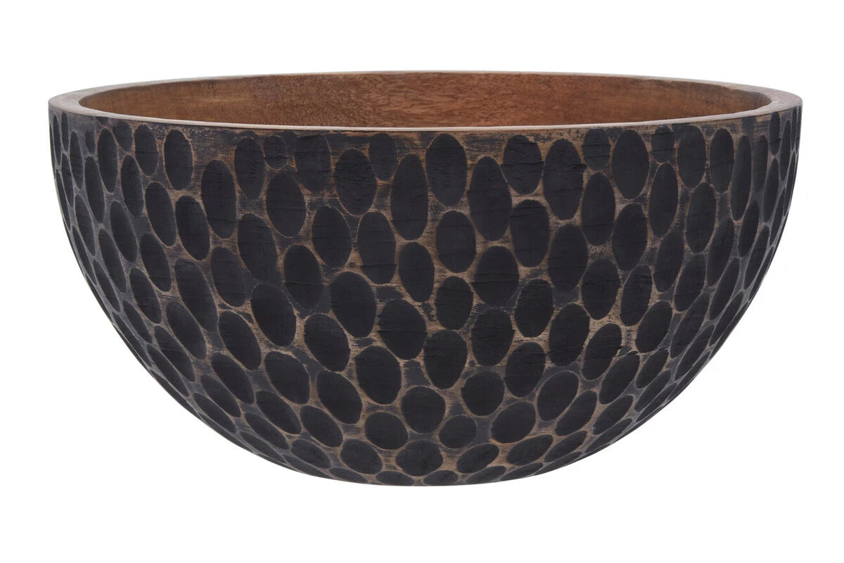 Side view of the Hewn mango wood bowl showing the black dimpled exterior
