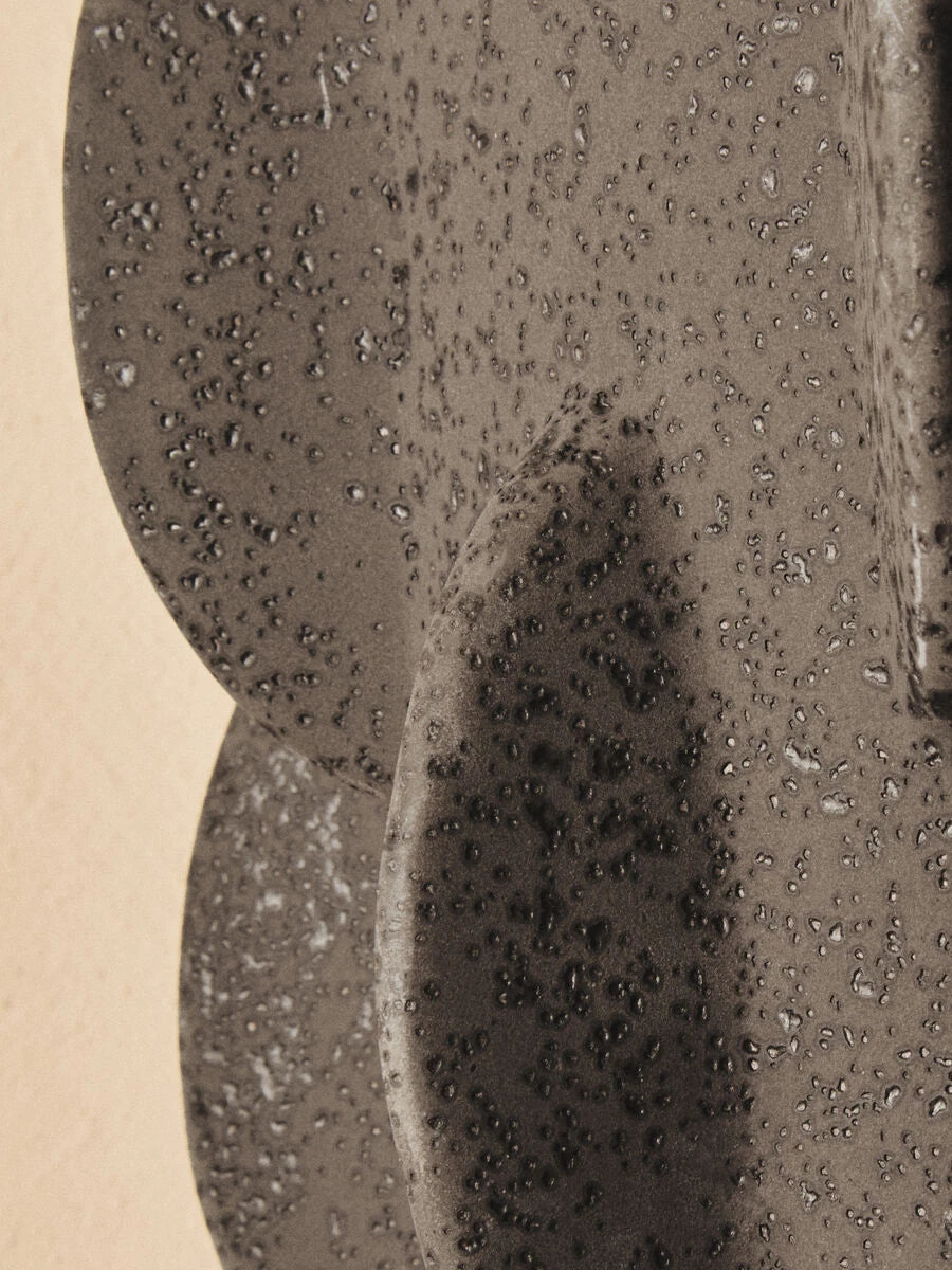 Iona Black Textured Stoneware Large Vase, styled in a living space.