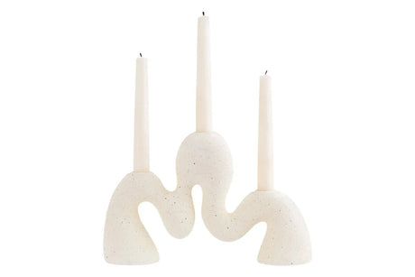 Soren Cream Organic Candle Holder, a cream textured candle holder with an undulating wave-like shape that holds three candles.