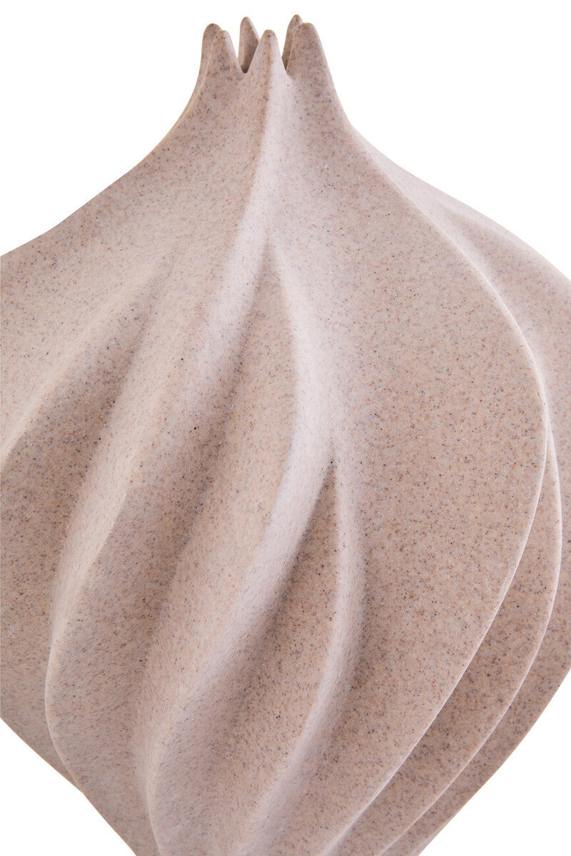 A ribbed sandstone effect vase on a white background