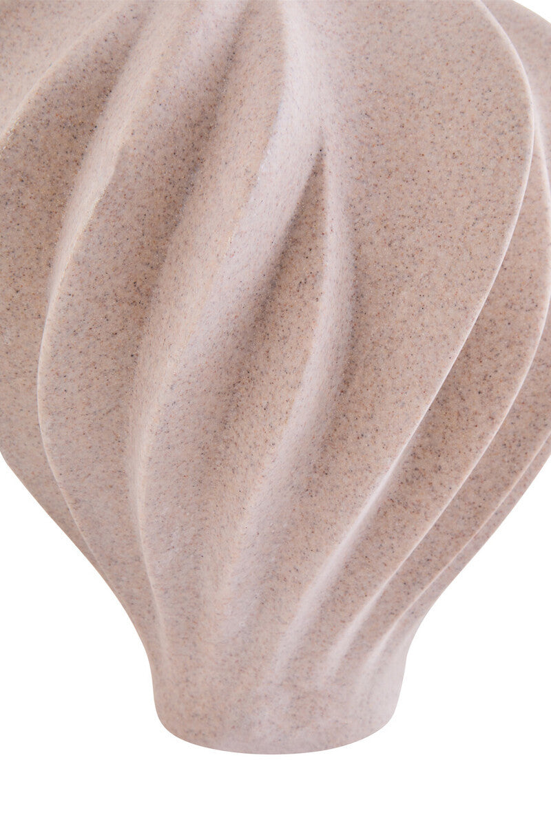 Close up of a sandstone effect textured vase on a white background