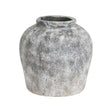 A aged stone effect ceramic vase with a round shape against a white background