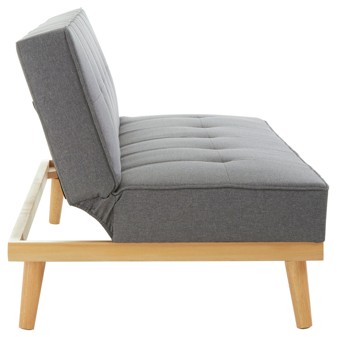 Side view of a grey fabric sofa bed with wooden frame on a white background