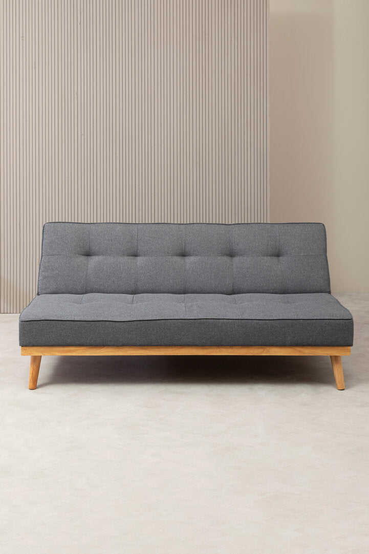 Front view of a grey sofa bed with wooden legs on a neutral background