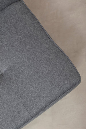 Gray fabric surface on a beige background