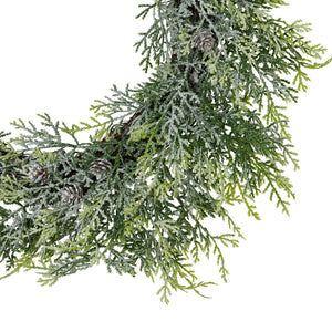 Close-up of the frosted pine needles and pinecones on the wreath