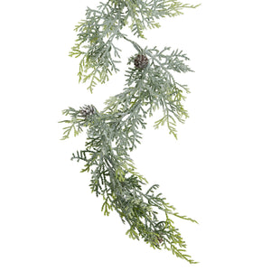 Frosted pine garland hanging to show its length and pinecones