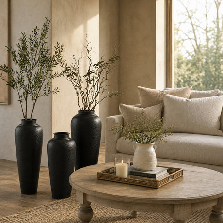 Living room with a beige sofa, round wooden coffee table, and decorative vases.