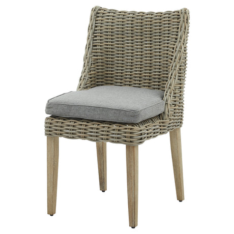 Outdoor dining chair with wicker backrest and grey seat cushion on a white background