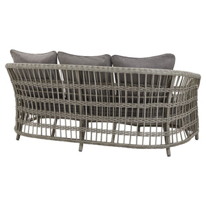 Rear view of a wicker outdoor sofa with three grey cushions on a white background