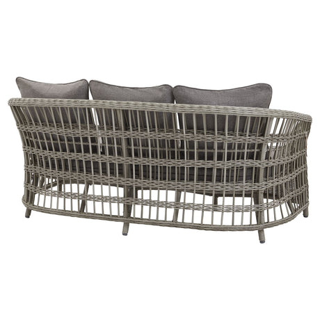 Rear view of a wicker outdoor sofa with three grey cushions on a white background