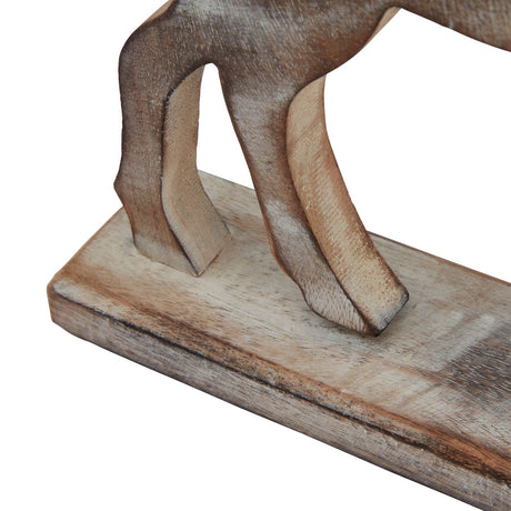 Close-up of the reindeer's raised leg and wooden plinth