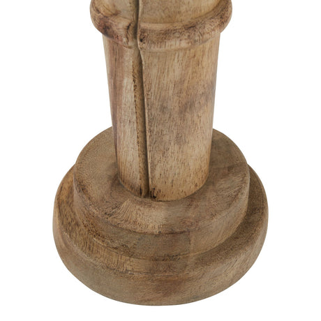 Close-up of the nutcracker's legs and round stepped wooden base