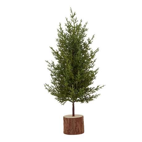 Small Green Fir Tree In Wood Log, a faux green fir on a slim trunk set in a round log slice