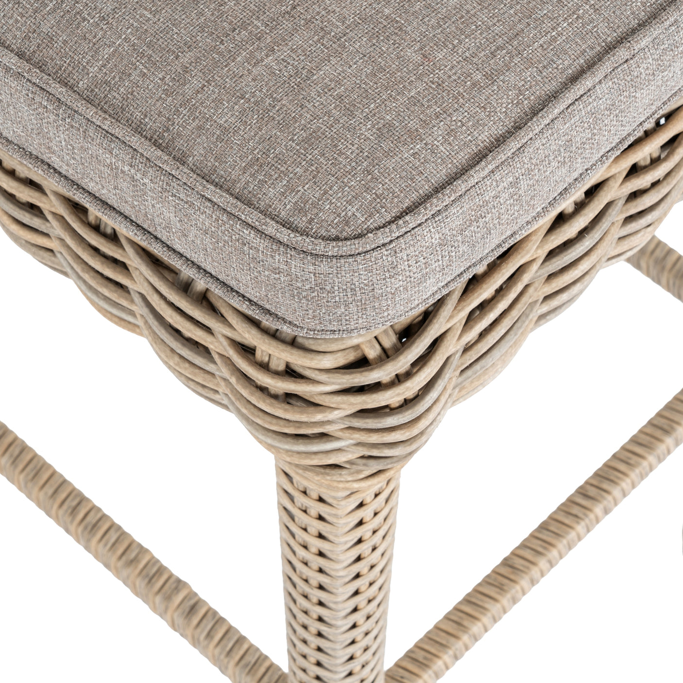 Wicker stool with a gray cushion on a white background