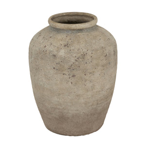 Textured clay vase on a white background