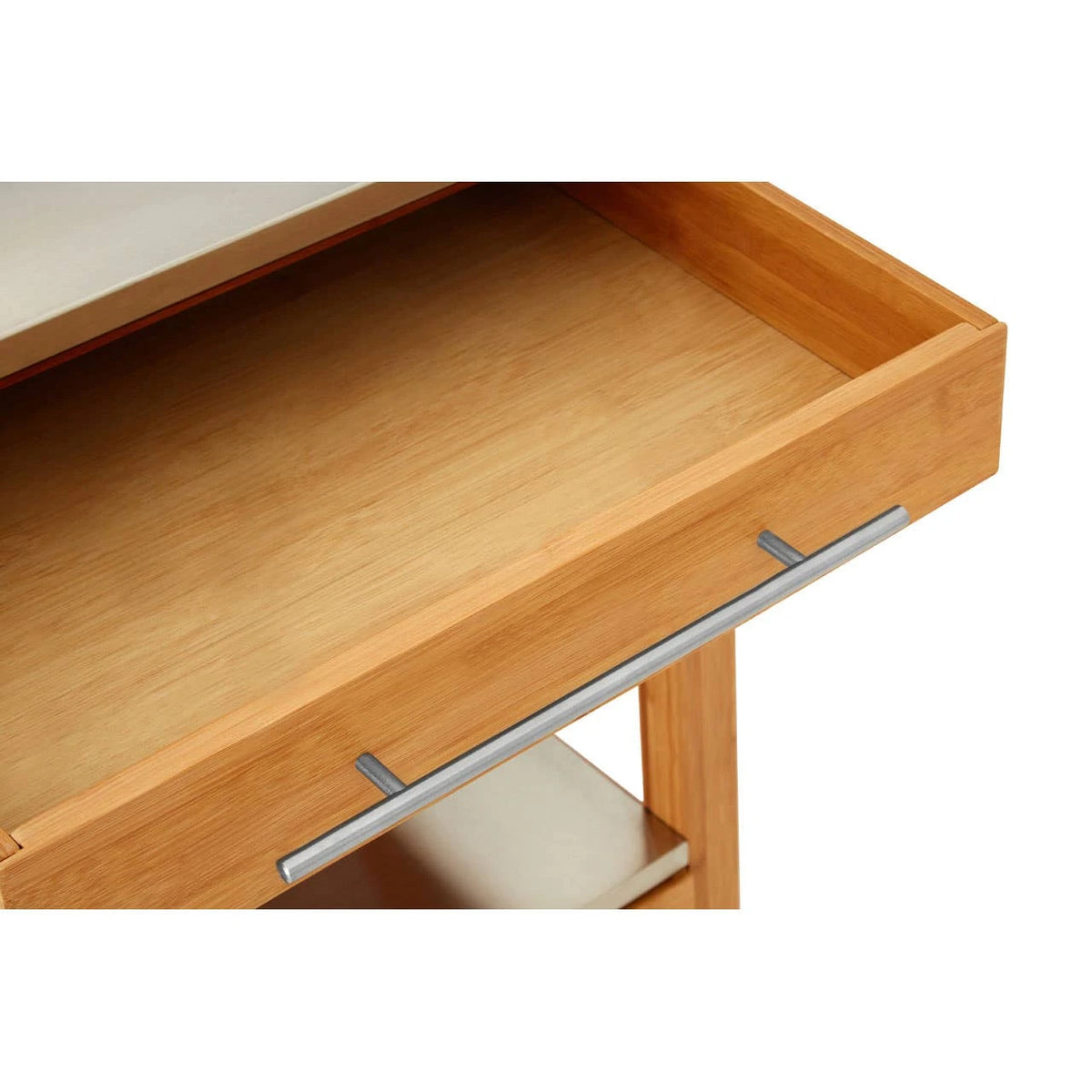 Close-up of the open top drawer of the Homestead Kitchen Trolley, showing the smooth bamboo interior and steel bar handle.