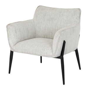A neutral armchair with black legs on a white background